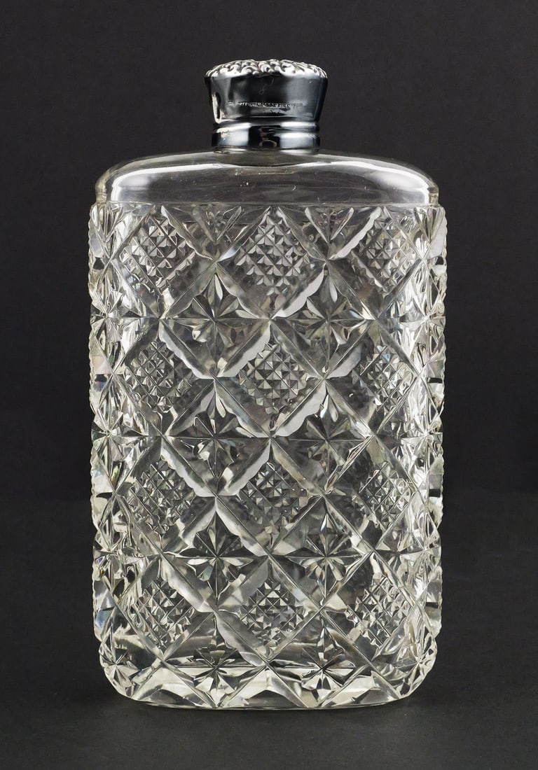R. Blackinton Sterling Silver Cut Glass Flask: Antique R. Blackinton & Co. American cut glass flask with sterling silver collar and screw cap, circa 1920. Heavy clear glass body features an all over geometric diamond, crosshatch and star-cut