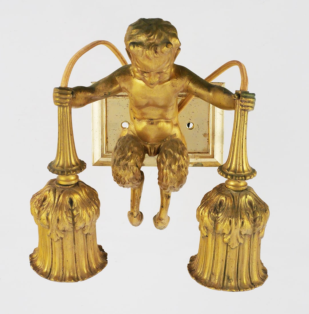 Neoclassical Revival Faun Satyr Light Sconce: Neoclassical / Rococo revival faun satyr figure wall light sconce. Measures approx 8-1/2" x 7-3/4" x 4-1/2". This item can be shipped in-house. Multiple lot combined shipping may require 3rd Party
