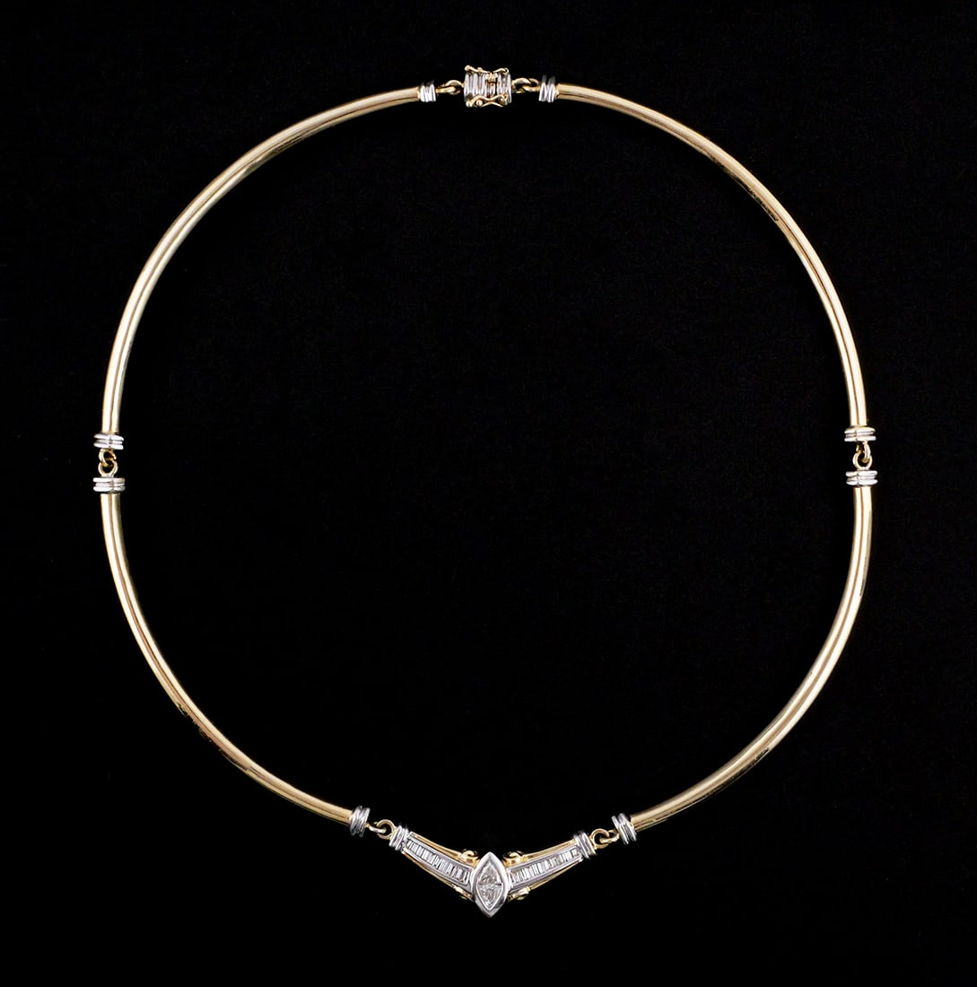 14K Gold & Diamond Contemporary Necklace: 14 karat yellow and white gold necklace set with diamonds. Modern minimalistic design accented by a diamond set panel. Central marquis shape composed of two trillion cut diamonds, approx. 3/4 carat