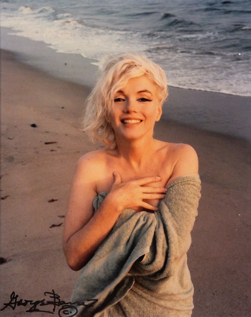 G. Barris MARILYN MONROE Photograph: Color photograph of Marilyn Monroe on the Santa Monica beach from her last photo session before her death, taken by George Barris in 1962, signed in black marker lower left. Image measures 9-1/2" x