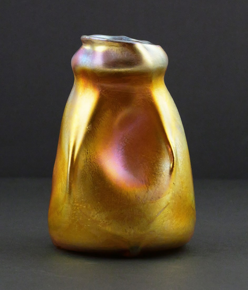 Signed L.C. Tiffany Favrile Iridescent Art Vase: Signed L.C. Tiffany Favrile Iridescent Art Glass Vase, ca. 1900, No. 897D. Measures approx 4-1/8" tall, 3" wide. This item can be shipped in-house. Multiple lot combined shipping may require 3rd Party