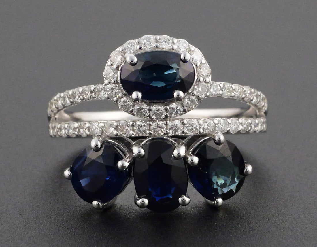 14K White Gold Sapphire Diamond Ring 3.67 CTW: 14K white gold ring set with four oval natural blue sapphires totaling 3.19 ct. and round brilliant-cut natural diamonds totaling 0.48 ct., F-G color, VS-SI clarity. Total gemstone weight 3.67 ct.
