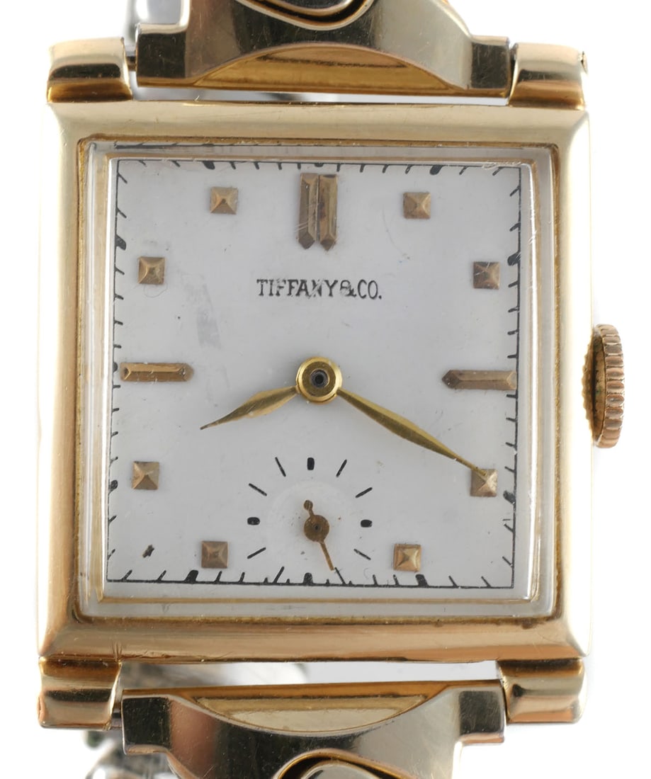 Tiffany & Co. 14K Gold Movado Wristwatch: Vintage Tiffany & Co. wristwatch with a 25 mm square 14K solid gold case manufactured by Movado for the U.S. market. Case interior marked "U.S.A. Movado," "14K Gold,". Manual-wind movement marked "Swi