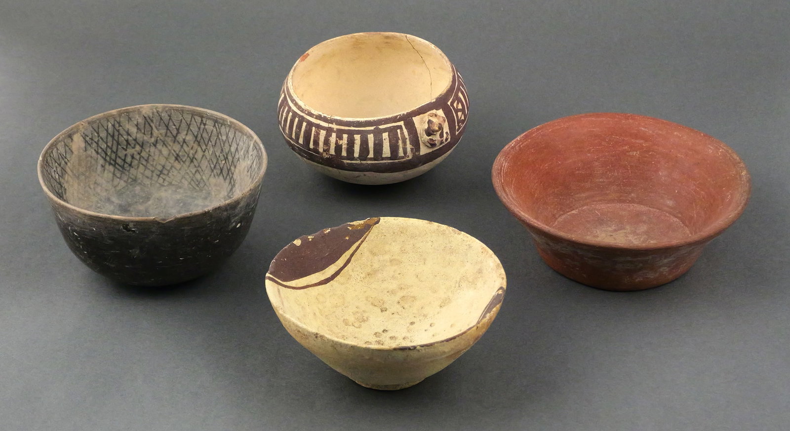 (4) Pre-Columbian Pottery Bowls: Group of four authentic pre-Columbian bowls. One decorated bowl with a frog effigy. One blackware bowl with burnished exterior and geometric design in the interior. One decorated bowl with circle