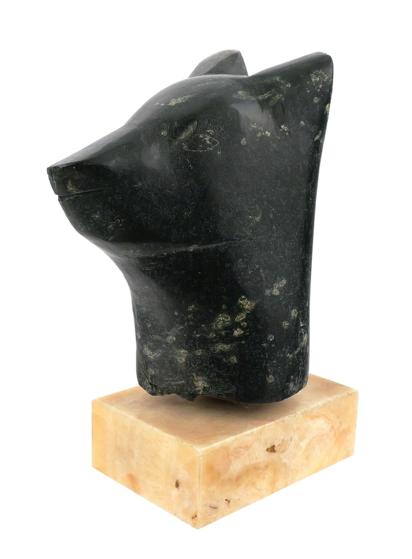 INUIT Carved Stone Animal Head, Large: Large gray-black stone animal head, possibly a bear or dog, mounted on marble base. From Gjoa Haven, an Inuit hamlet in Nunavut, the only settlement on King William Island. Overall size is 10-1/2"