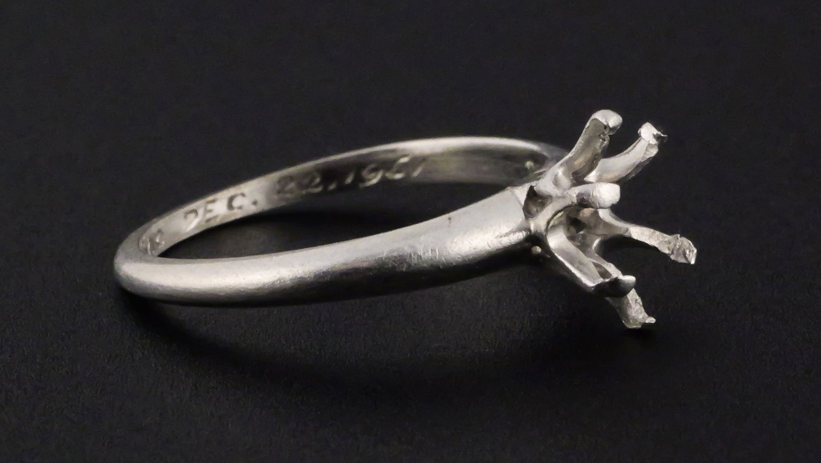 Platinum Tiffany & Co Engagement Ring: Iridium Platinum Tiffany & Co Ring. Engraving inside reads "CVL to HMC December 22, 1961". No stone. Weight approx 2.5 grams. Size 4.5. This item can be shipped in-house. Multiple lot combined