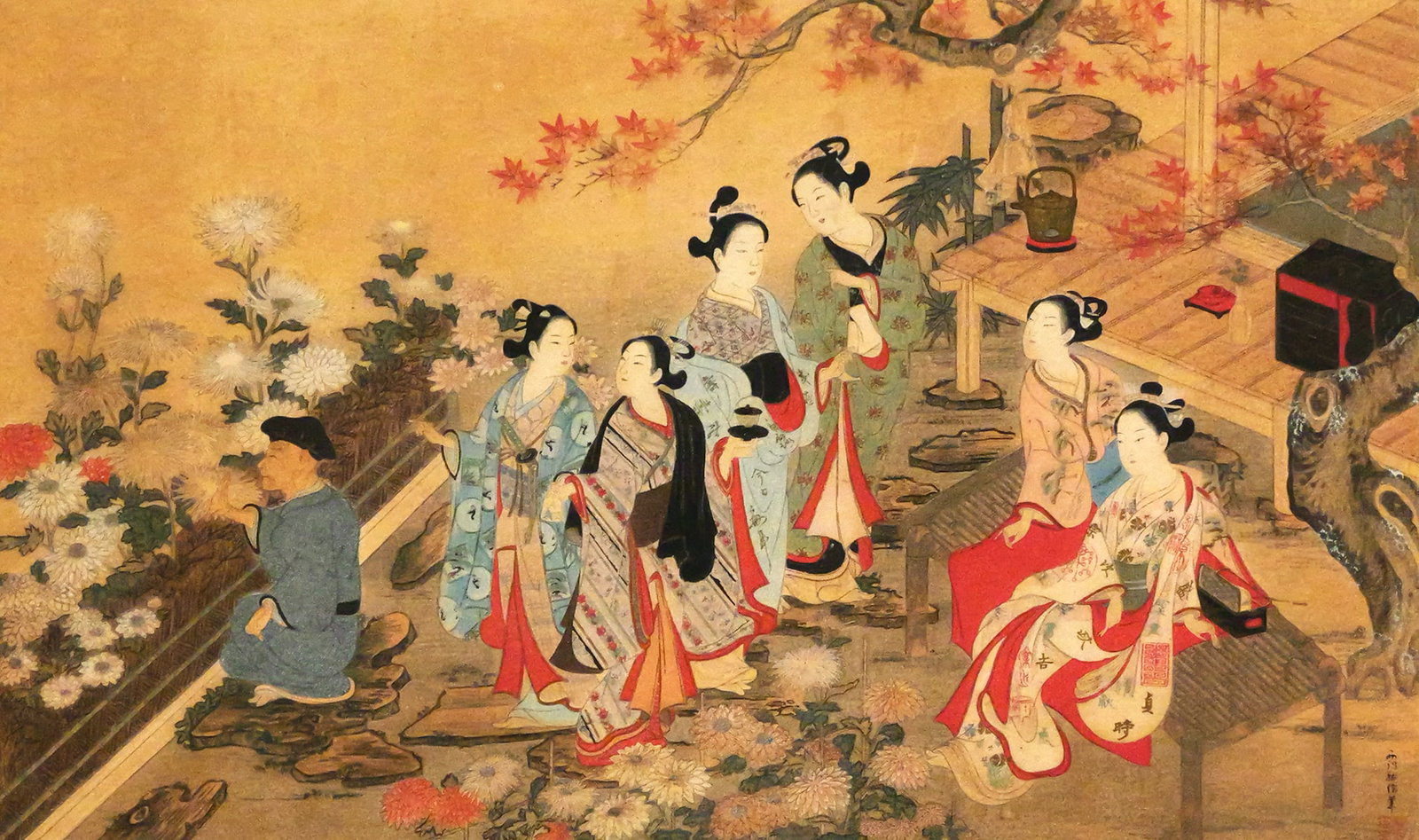 Sukenobu, Nishikawa Japanese Woodblock Print: Traditional Japanese woodblock print featuring women in kimonos, possibly court figures, in an outdoor setting with autumn leaves and chrysanthemums, the print is surrounded by a gold leaf border,