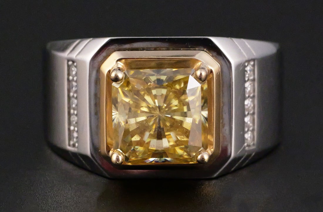 14K Two-Tone Gold 3.5 CT Yellow Moissanite Ring: 14K two-tone gold men's ring set with an 8 x 8 mm square radiant-cut yellow moissanite. GRA report identifies the stone as 3.5 ct, Vivid Yellow color, VVS1 clarity and Excellent cut. Accented with