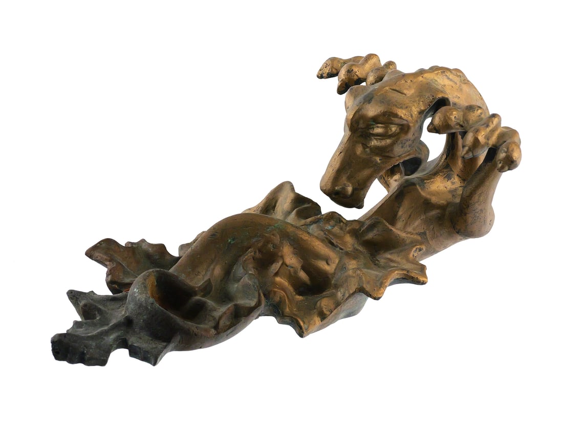 Gothic Revival Bronze Dragon Curtain Rod Holder: Gothic Revival bronze curtain rod holder or wall bracket, modeled as a projecting dragon with raised clawed forelegs and elongated foliate wall plate. Hollow cast construction with two mounting