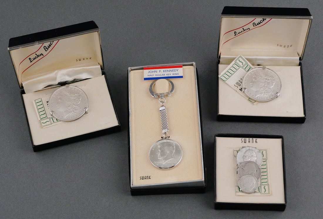 Vintage Swank Silver Coin Money Clips Keychain: Vintage Swank Silver Coin Money Clips and Keychain. Includes a 1964 Kennedy half dollar keychain, 1885 Morgan silver dollar money clip (x2) and a 3 silver coin money clip. This item can be shipped