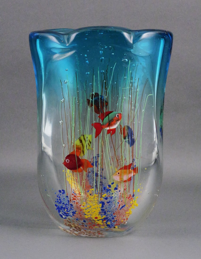 Large Aquarium Fish Art Glass Vase: Large heavy art glass vase with an underwater scene of multi colored tropical fish, aquatic vegetation, bubbles and colorful glass inclusions. Thick clear glass body shading to aqua blue at the irregu