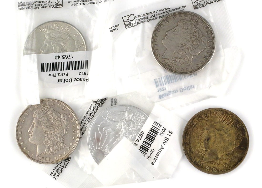 (5) American Silver Dollars 1890-2002: (5) US American Silver Dollars 1890-2002. Includes a 1922 Peace Dollar (x2), 2002 American Eagle Dollar, 1921 Morgan Dollar, 1890 Morgan Dollar. This item can be shipped in-house. Multiple lot combine