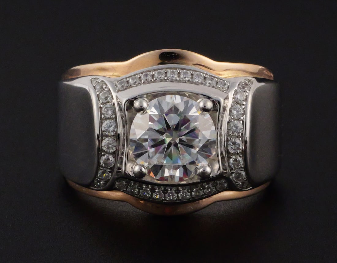 14K Two-Tone Gold 2 CT Moissanite Men's Ring: 14K two-tone gold men's ring set with an approximately 2 ct round Esdomera created moissanite center stone and cubic zirconia side stones. Includes Esdomera certificate of authenticity and warranty