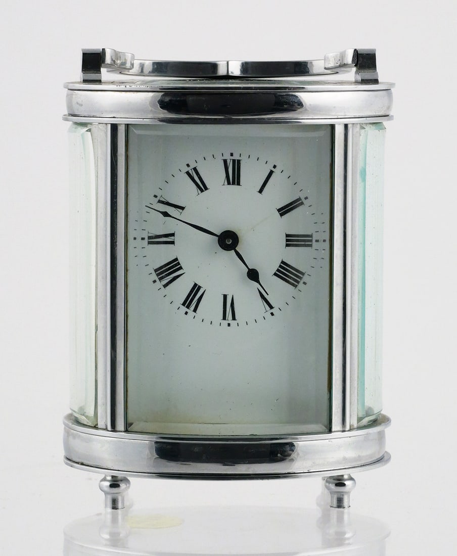 20th Century French Oval Carriage Clock: 20th Cent. French Oval Brass & Glass Carriage Clock. Measures approx 6" (with handle). Has heavy bevelled glass with Ornate Top Handle. This item can be shipped in-house. Multiple lot combined