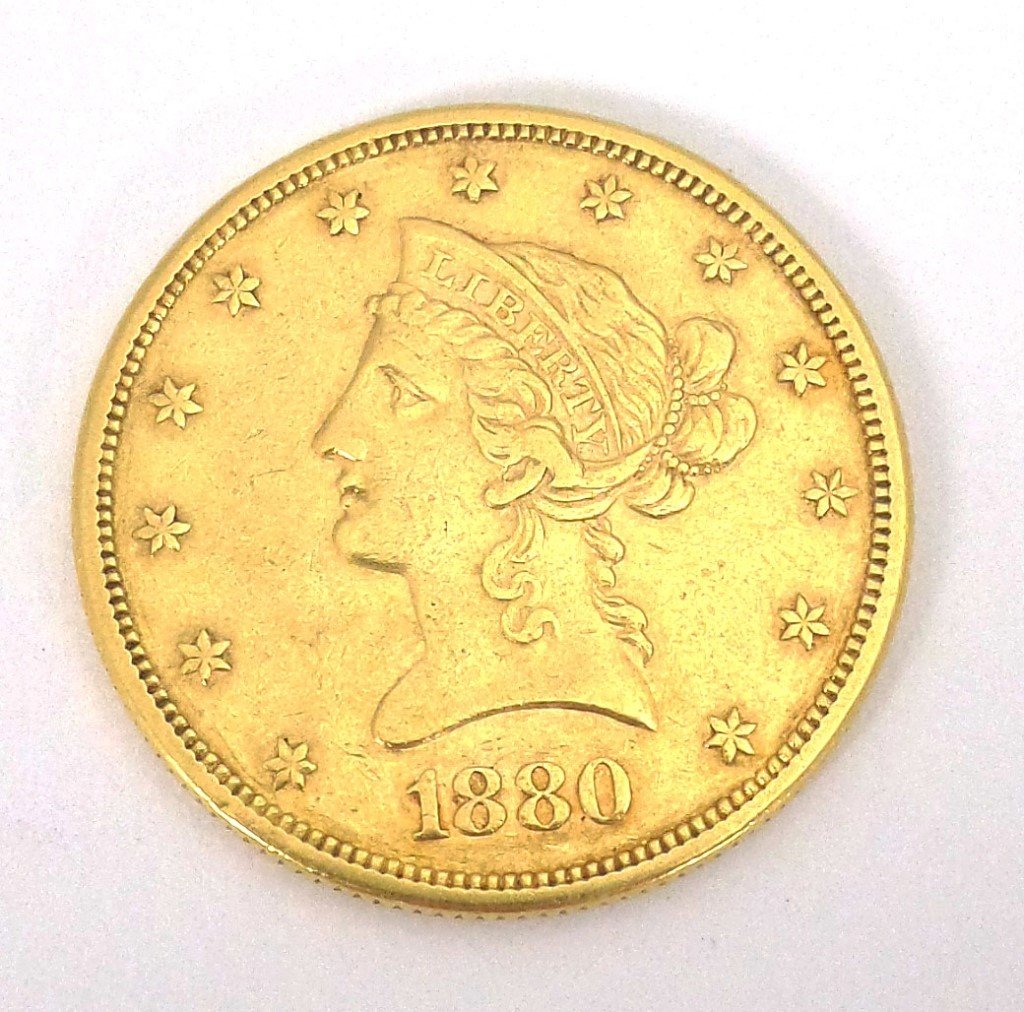 1880- s U.S. gold liberty coin ungraded: 1880-s eagle gold coin. The grade is VF- XF. Estimate $650 - $750