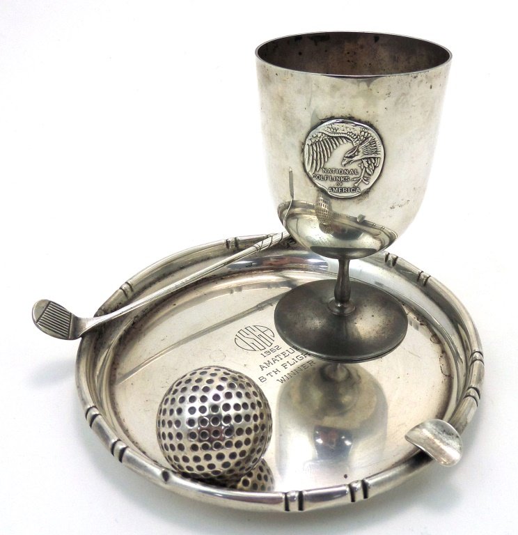 3-piece vintage Golf-related sterling silver lot, 9.25: Includes 1981 trophy, 1962 ashtray and lifesize golf ball, all in solid sterling silver. Ashtray measures 6-1/2" diam. Total sterling weight 9.25 Troy ounces.