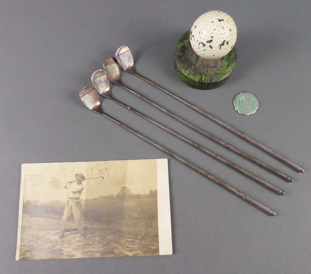 Tray Lot of Vintage Golf items, incl Postcard, Stir: Old cast iron golf ball paperweight, four silver pitching wedge stir sticks, an old postcard from 1908, and 1962 PGA charm.