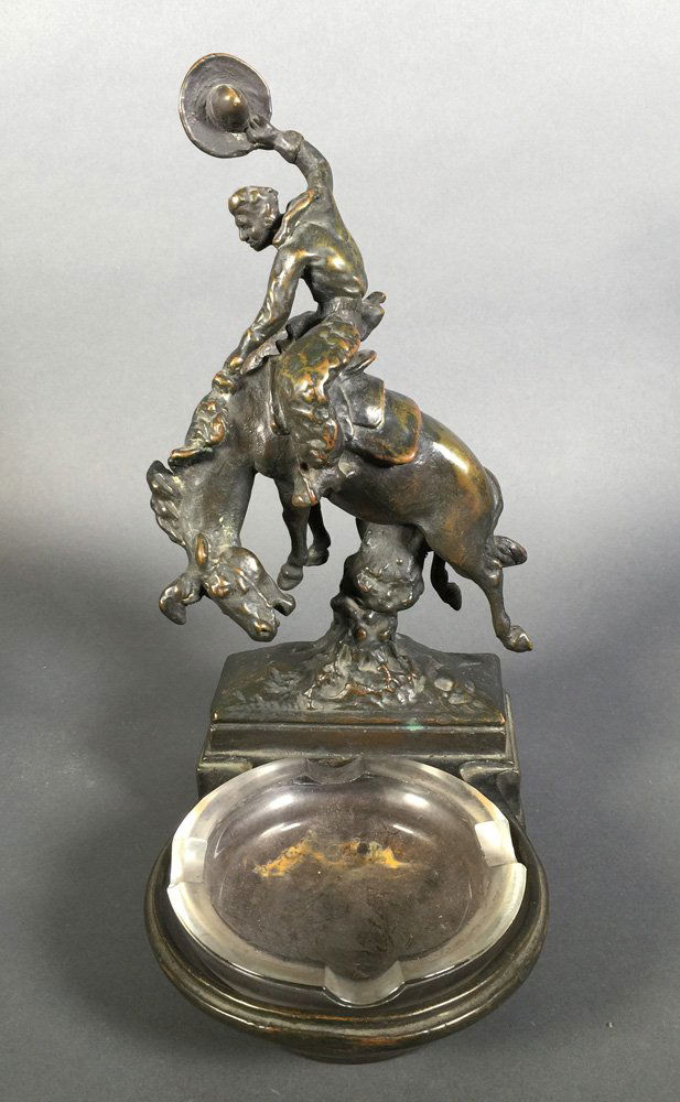 Pompeian Bronze Cowboy Trinket Dish Ashtray: Vintage bronzed cowboy on bucking horse after Paul Herzel, signed on rear of base. Came out of estate with ashtray in front holder, but it might be just a holder for keys and coins. Pompeiian Bronze t