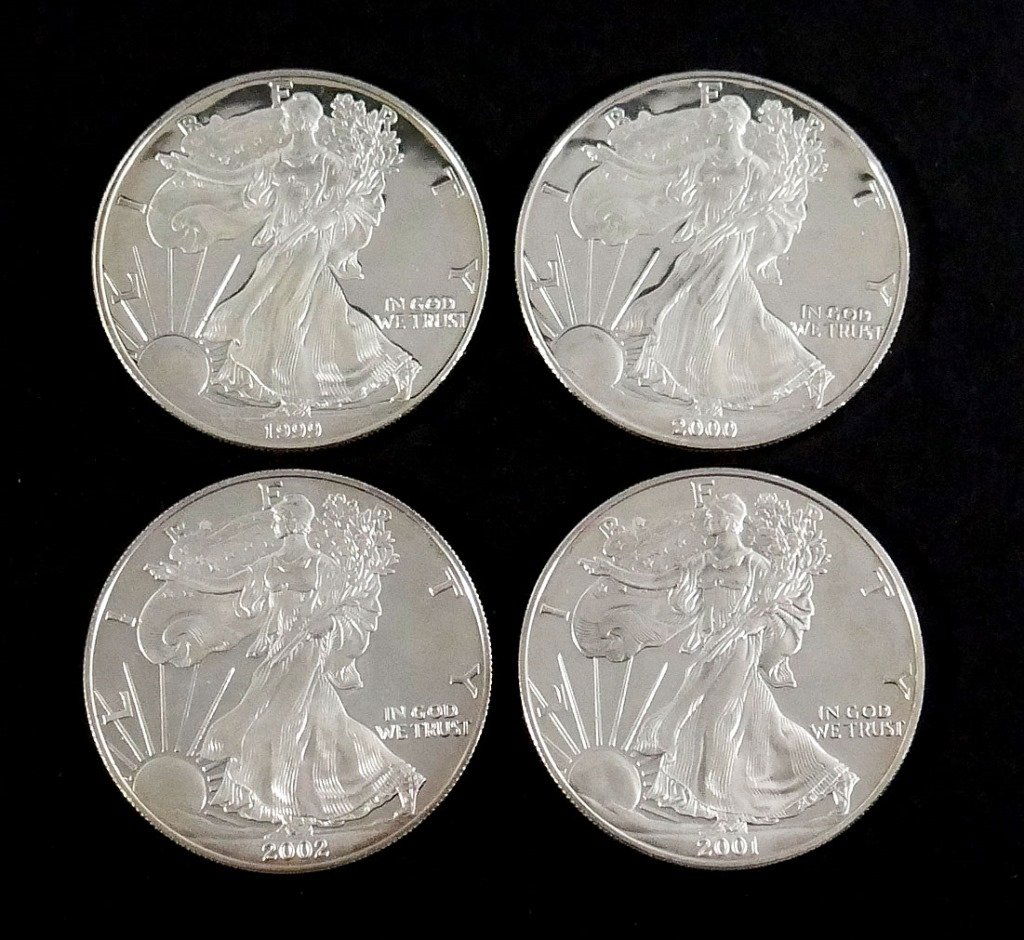 4 US Proof SILVER EAGLES 1 oz .999: 1999, 2000, 2001 and 2002. Bright uncirculated.