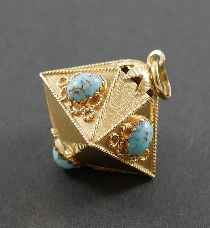 Edwardian 18k Yellow Gold Turquoise Pendant: 18k yellow gold octahedron shaped charm, about 1-1/4" high and 7/8" square, each panel mounted with turquoise cabochon. Weighs 11.9 grams.