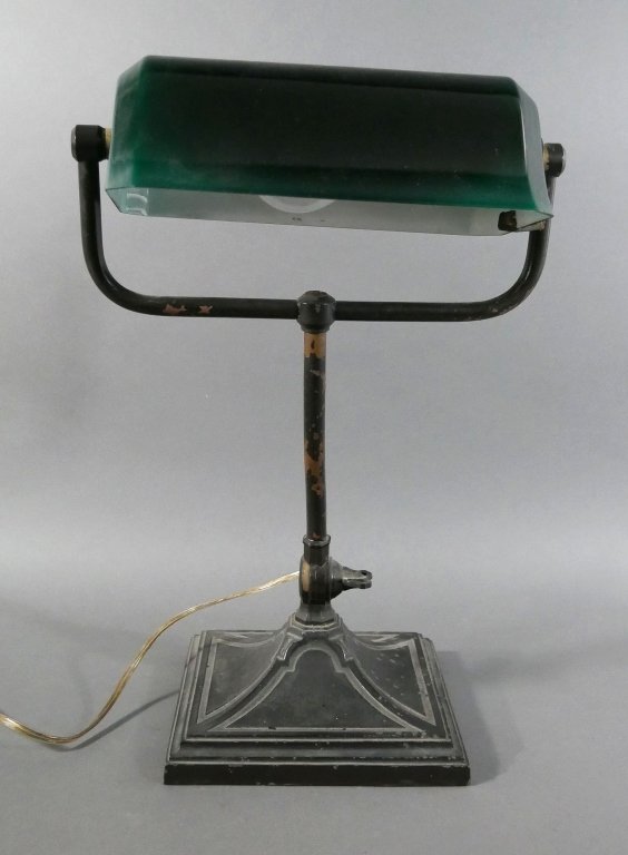 Early 20C GREENALITE Cased Glass Green Shade Lamp: Old piano (or bankers) lamp base -- black painted, with some paint loss -- with very fine Greenalite shade with beveled ends. Lamp base is 7" square, shade is 8-1/2" wide.