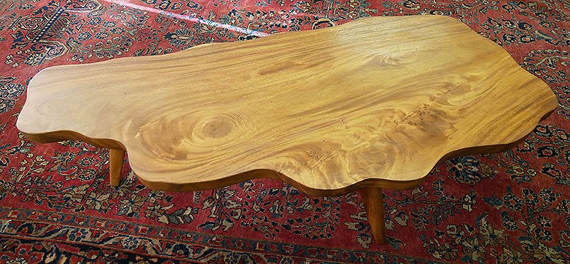 Midcentury Monkey Pod Wood Coffee Table Nakashima: Vintage Nakashima style coffee table made of solid slab of monkey pod wood. 54-3/4" long, 15-1/2" high. Fine condition.