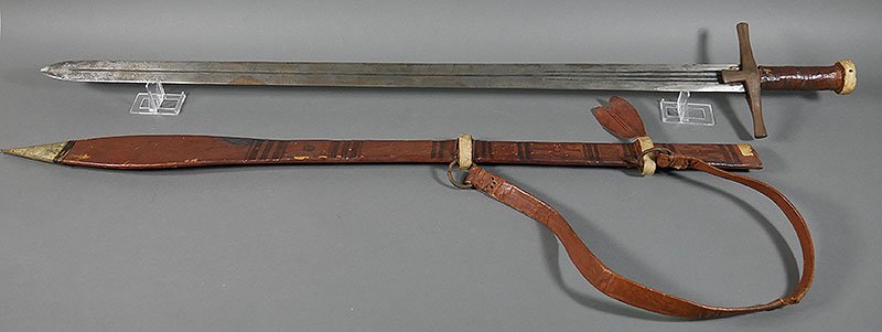 Vintage Middle Eastern Souvenir Sword: Measures 42" overall. Leather and brass sheath.