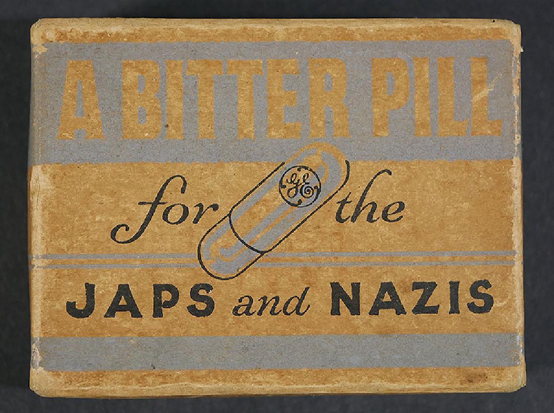 Rare General Electric WWII Rocket Fuse Advertising: "A BITTER PILL for the JAPS and NAZIS," is printed boldly across the front of this 2" x 3" box, along with the General Electric logo. Inside are four glass items -- one filled with liquid -- that made
