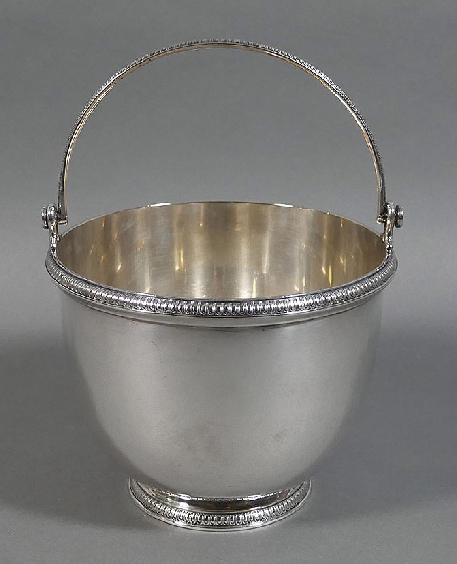 CHRISTOFLE Handled ICE BUCKET Silver Plate France: Fine silverplated piece by Christofle, an ice bucket with pierced, footed insert. Measures 6-1/8" diameter and about 8-1/4" high with handle up. No monogram. Little wear. Excellent condition. We're se