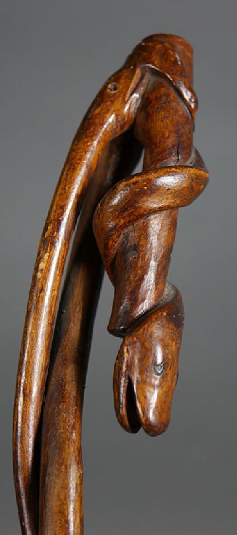Walking Stick: Snake Folk Art Carved Wood: One of several estate walking sticks in today's auction. Good condition, with typical wear.