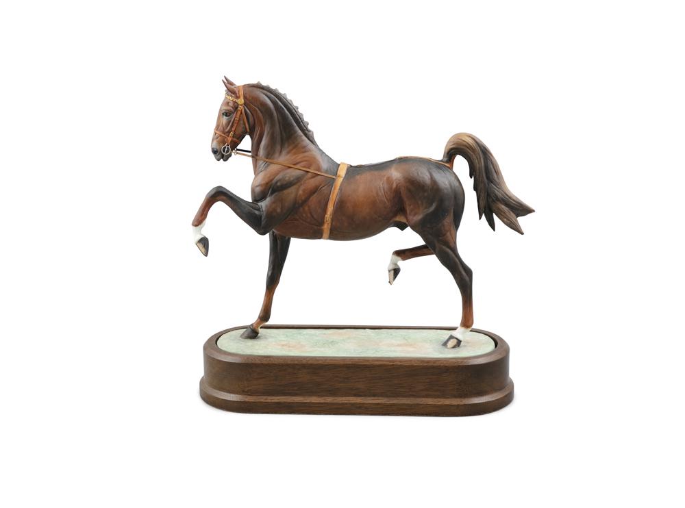 A ROYAL WORCESTER PORCELAIN MODEL OF A HACKNEY: A ROYAL WORCESTER PORCELAIN MODEL OF A HACKNEY STALLION, modelled by Doris Lindner, model no.29/500, set into an oval timber base, with certificate. 28 x 7 x 25.5cm high