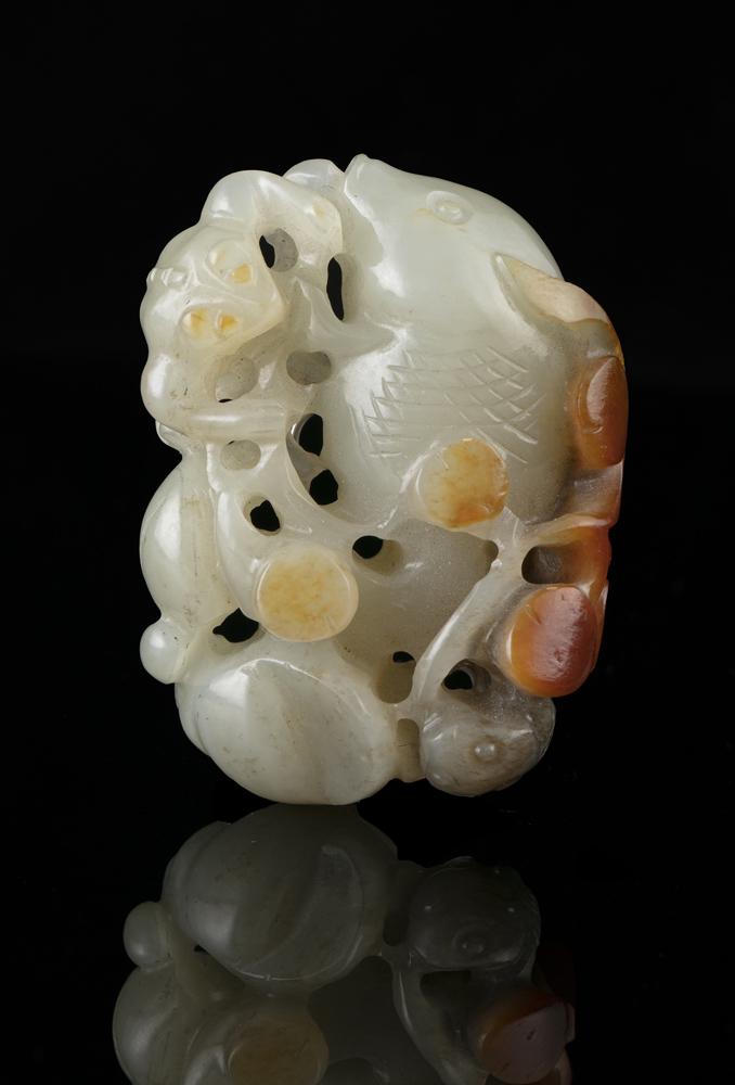 A WHITE AND RUSSET JADE GROUP CARVING OF A GOLDFISH OF (1 of 8)