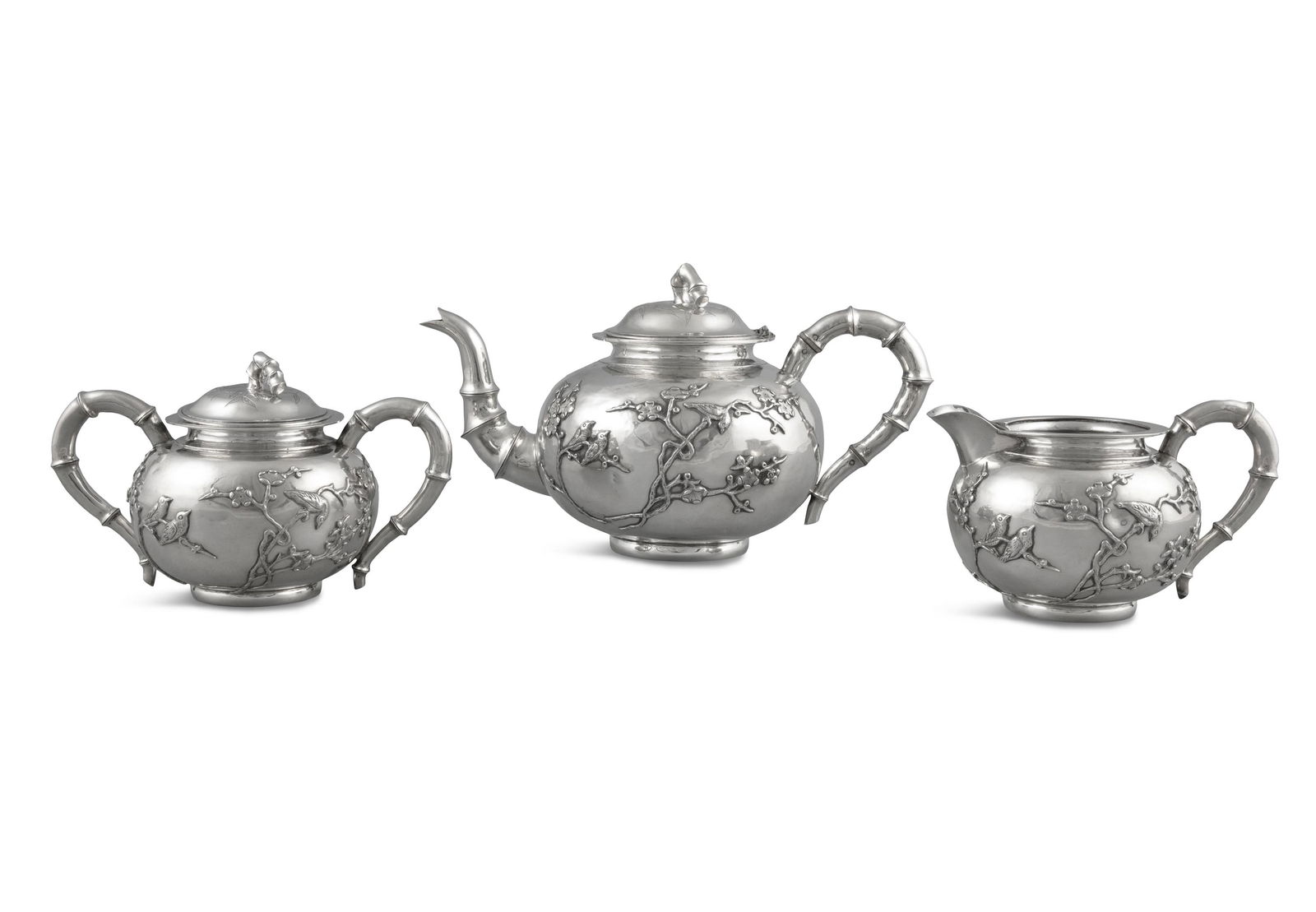 A ‘XI SHANG MEI SHAO’ CHINESE EXPORT SILVER: A ‘XI SHANG MEI SHAO’ CHINESE EXPORT SILVER THREE-PIECE TEA SET BY RUI HUA JIN DIAN 瑞華金店 OF TIANJIN China, Tianjin, Circa 1900 Comprised of one lidded teapot, o