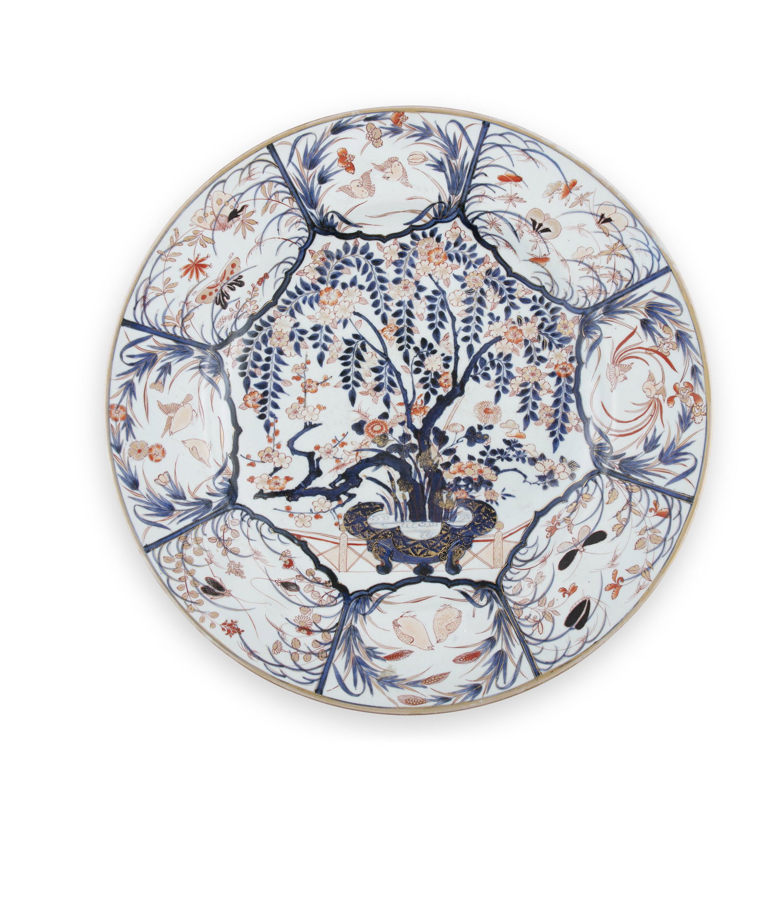 A MASSIVE JAPANESE IMARI CHARGER Japan, Edo to Meiji: A MASSIVE JAPANESE IMARI CHARGER Japan, Edo to Meiji period, 19th century Of shallow circular form, decorated in red, blue and gilt against a white ground, centred with still life group and eight radi