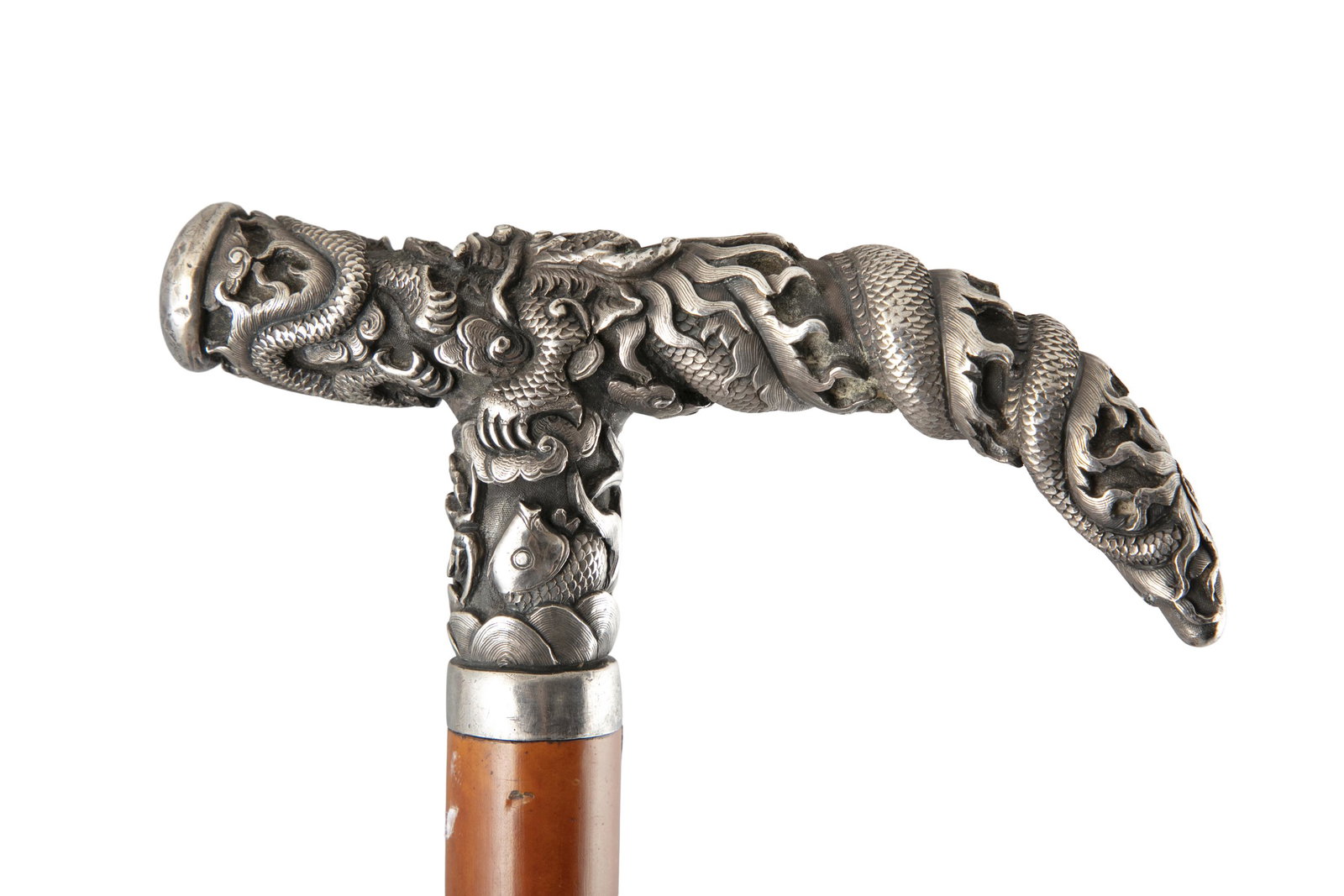 A VIETNAMESE / INDOCHINESE SILVER HILTED WALK STICK: A VIETNAMESE / INDOCHINESE SILVER HILTED WALK STICK Vietnam / Indochina, Possibly 1920s The grasp, made of silver, is deeply chiselled with the theme of ‘Liyutiaolongmen’ ( 鲤鱼