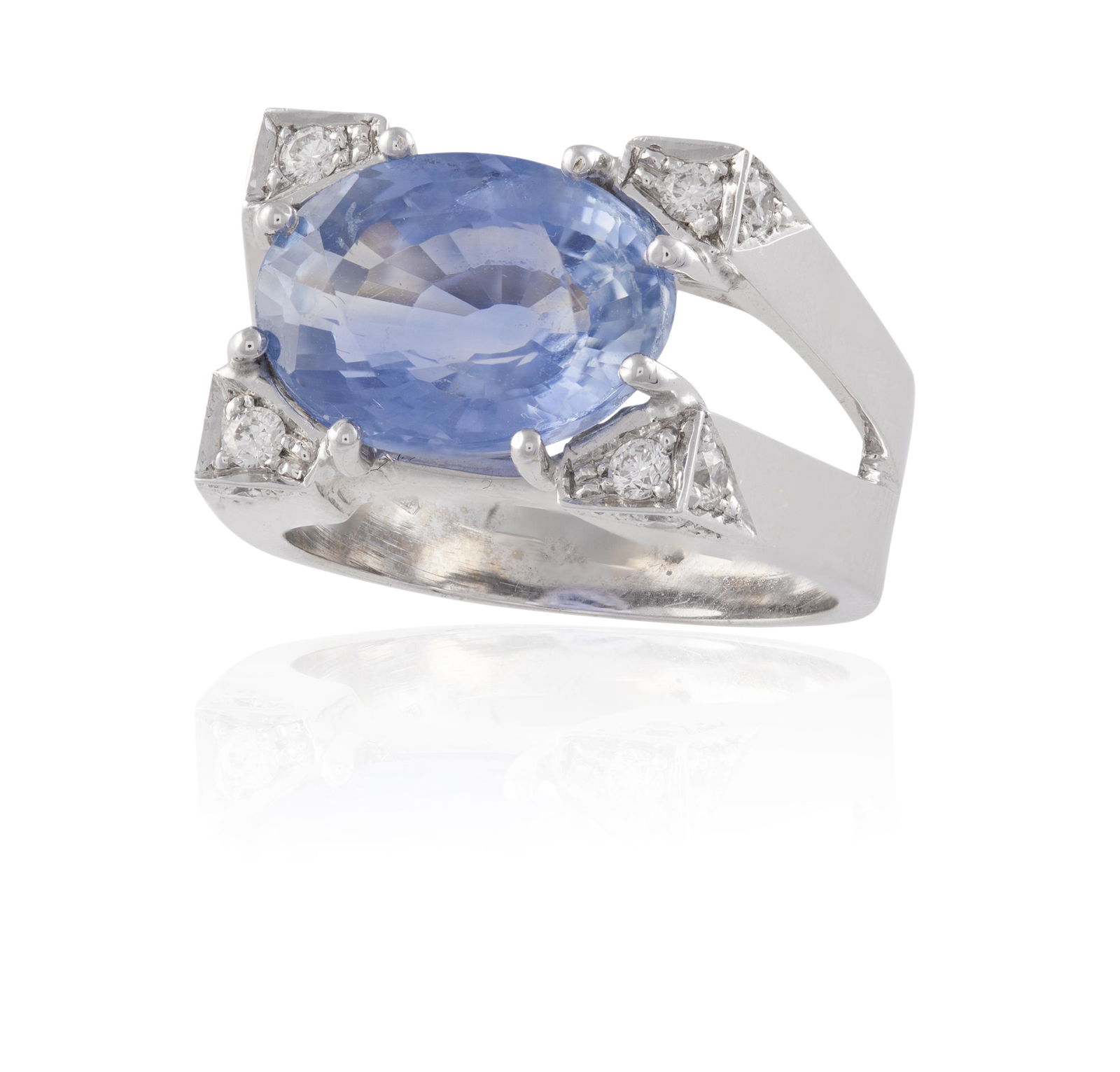 A SAPPHIRE AND DIAMOND RING, Of sculptural design, the (1 of 2)