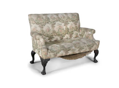 AN IRISH GEORGIAN REVIVAL MAHOGANY TWO-SEAT SETTEE, covered in a cream 'pettie-point' fabric with: AN IRISH GEORGIAN REVIVAL MAHOGANY TWO-SEAT SETTEE, covered in a cream 'pettie-point' fabric with padded back and seat, out scrolling arms, shell capped carbide legs with claw and ball feet. 124cm