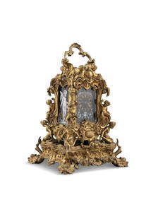 A FRENCH GILTMETAL AND PORCELAIN MOUNTED CARRIAGE CLOCK BY LUCIEN OF PARIS C.1845, with raised swing: A FRENCH GILTMETAL AND PORCELAIN MOUNTED CARRIAGE CLOCK BY LUCIEN OF PARIS C.1845, with raised swing handle, body bodly cast and chased with scrolls, putti and scallop shells fitted with classical