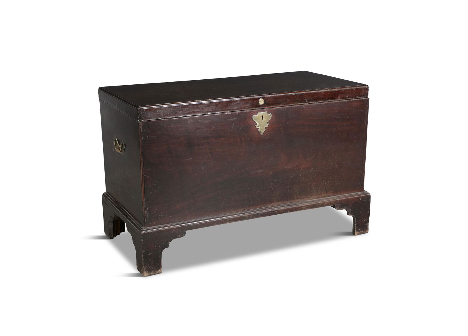 A GEORGE III MAHOGANY BLANKET CHEST, the hinged lift top with moulded rim, with brass escutcheons (1 of 2)
