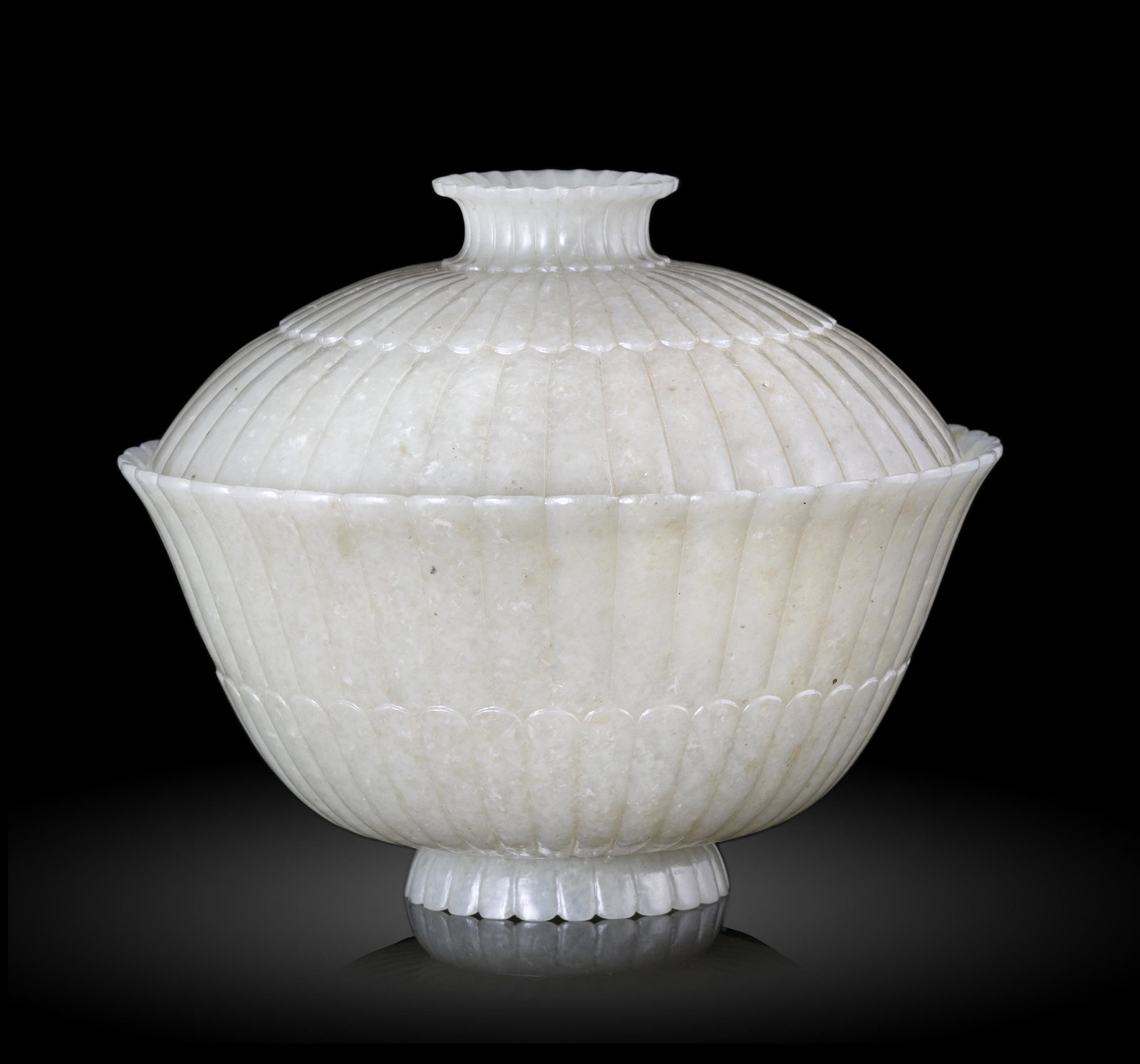 PROPERTIES FROM A NOTED COLLECTION OF JADES AND SNUFFBOTTLES *A MUGHAL-STYLE JADE BOWL AND COVER: PROPERTIES FROM A NOTED COLLECTION OF JADES AND SNUFFBOTTLES *A MUGHAL-STYLE JADE BOWL AND COVER CHINA, QING DYNASTY The covered tea bowl is very thinly and evenly carved and polished with each petal 