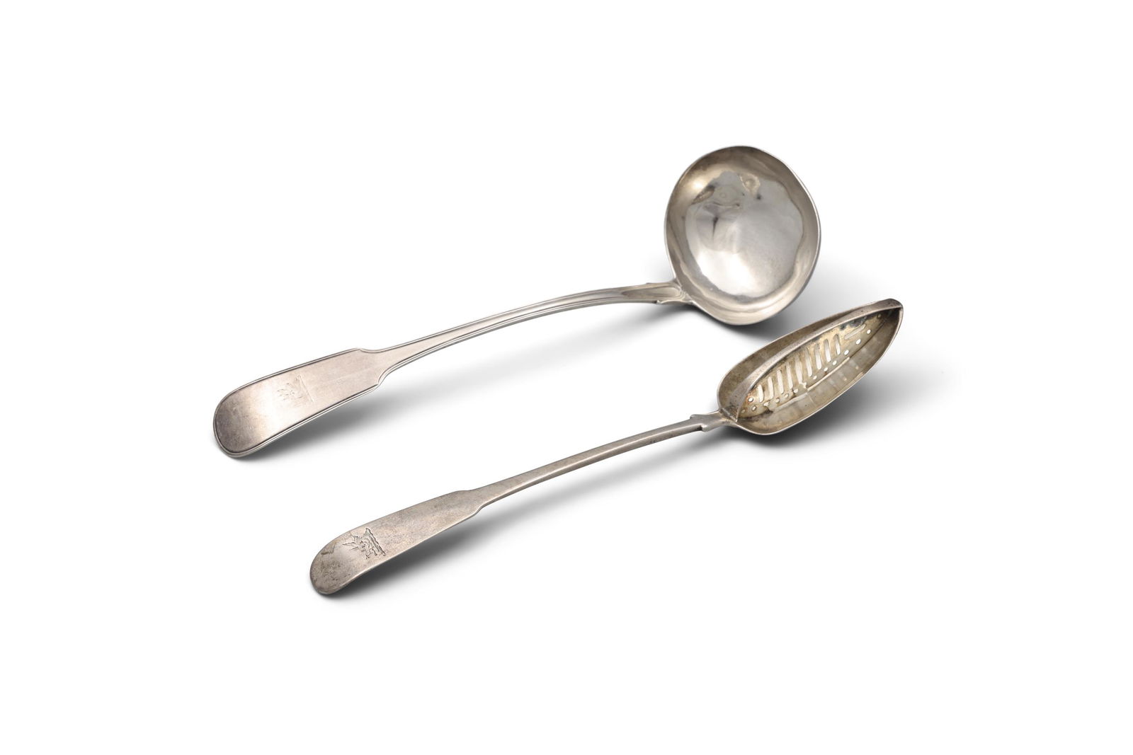 AN IRISH GEORGE III SILVER FIDDLE PATTERN STRAINING SPOON, Dublin c.1806, mark of William Ward, 31cm: AN IRISH GEORGE III SILVER FIDDLE PATTERN STRAINING SPOON, Dublin c.1806, mark of William Ward, 31cm long; together with a George III fiddle and thread pattern soup ladle Dublin c.1818 mark of James E