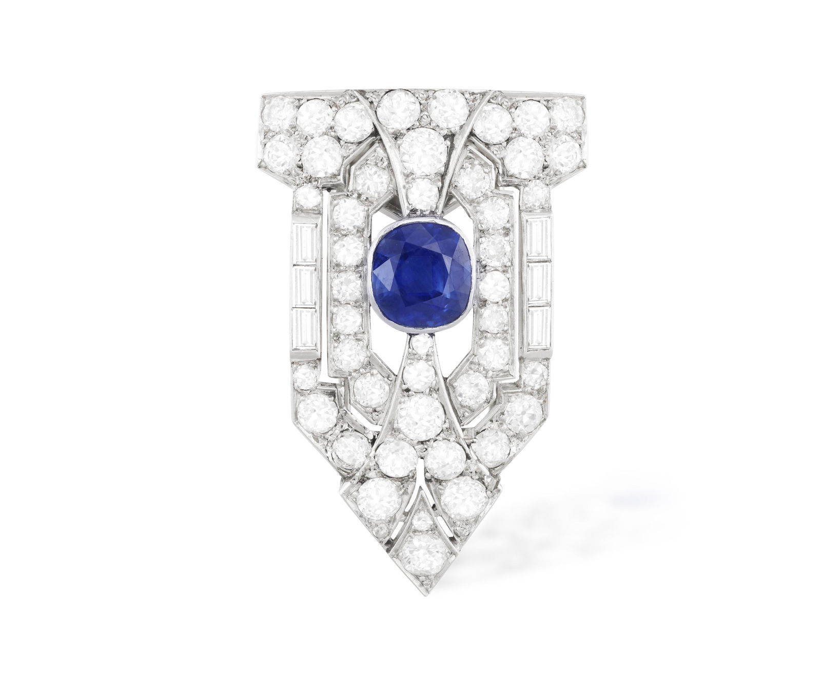 AN ART DECO SAPPHIRE AND DIAMOND CLIP, CIRCA 1930  Set with a cushion-shaped sapphire within (1 of 2)