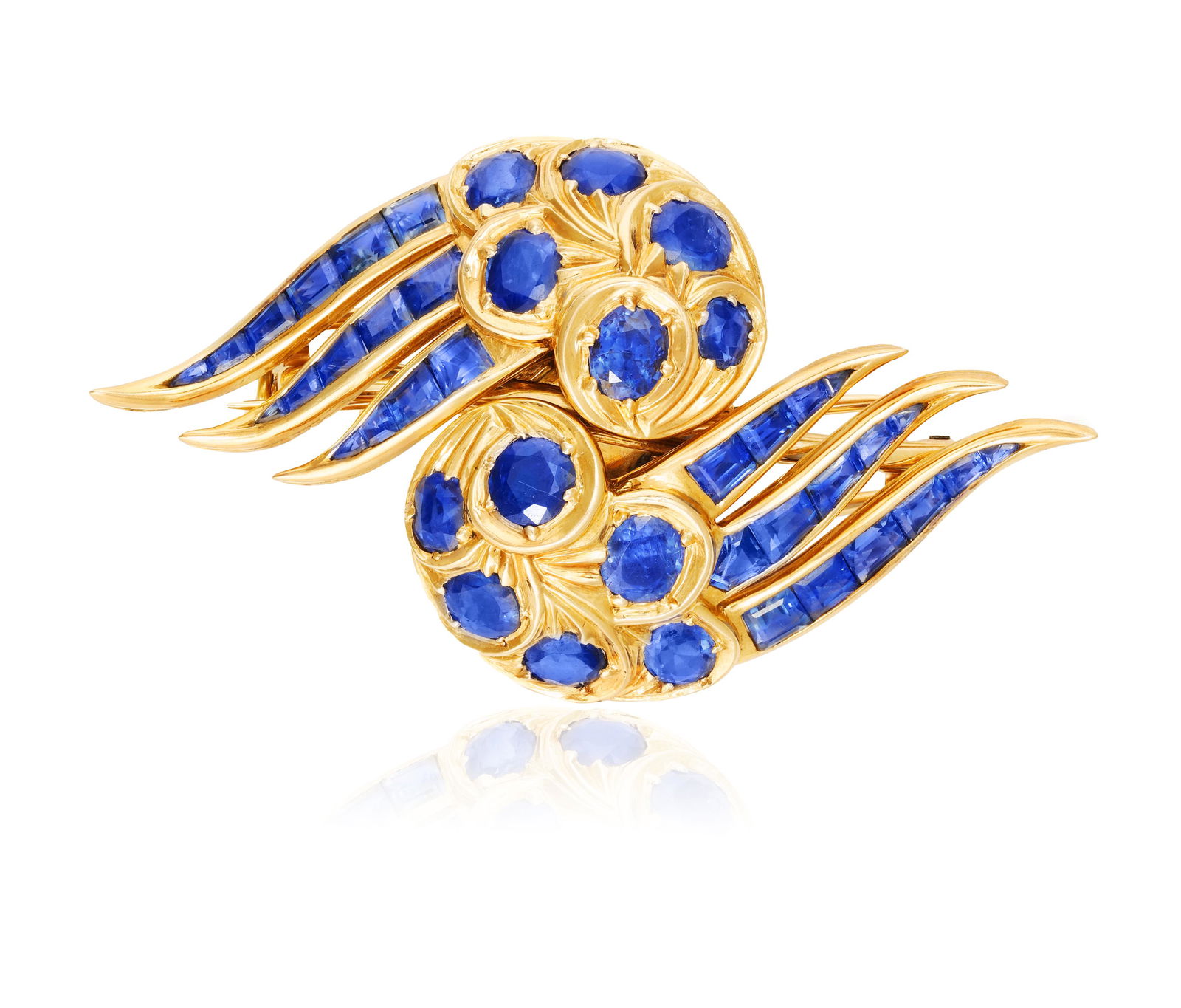 A SAPPHIRE DOUBLE CLIP BROOCH, BY RENÉ BOIVIN, CIRCA 1955  Composed of two stylised wings set (1 of 7)