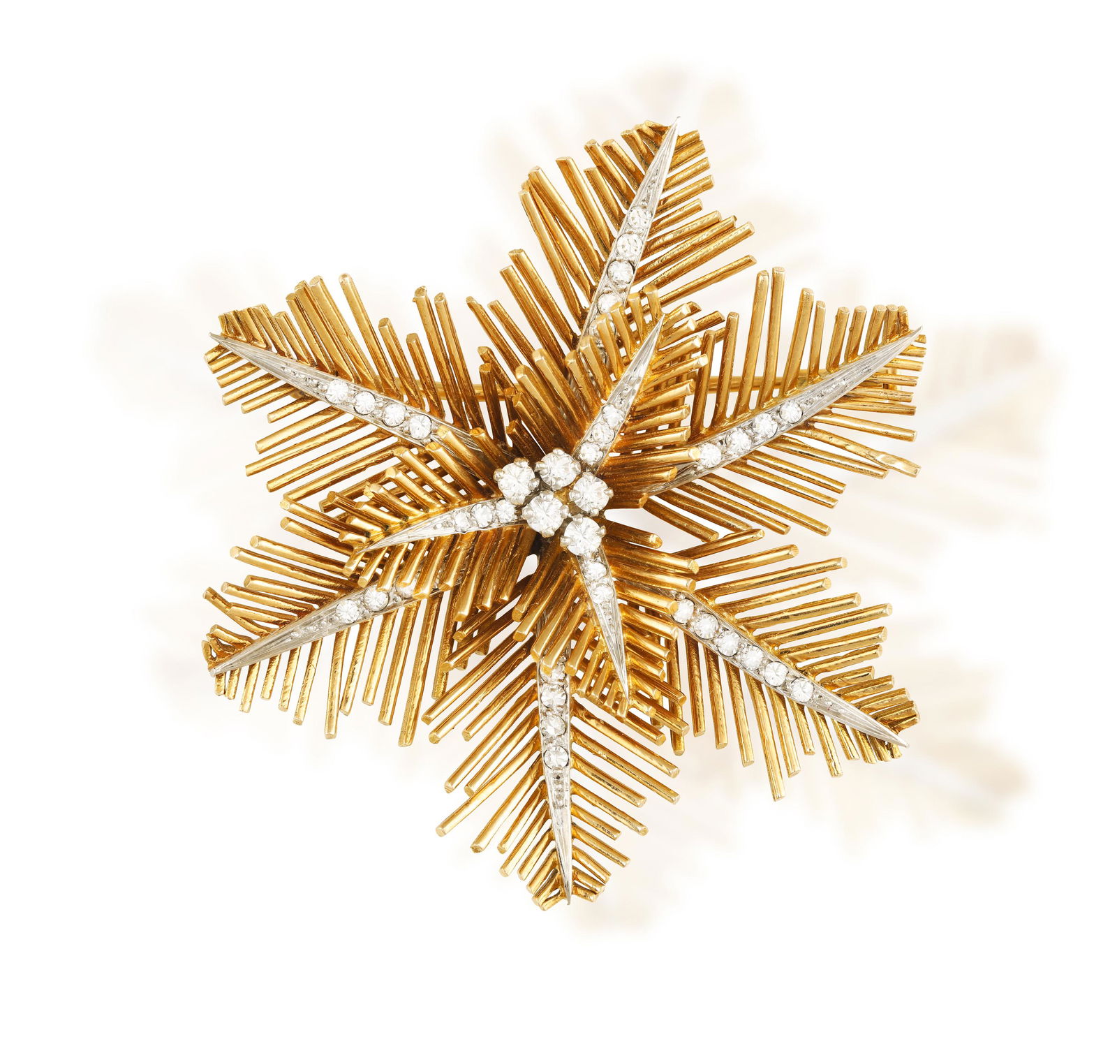 A DIAMOND BROOCH, CIRCA 1950  The stylised snowflake set with a central brilliant-cut diamond (1 of 5)