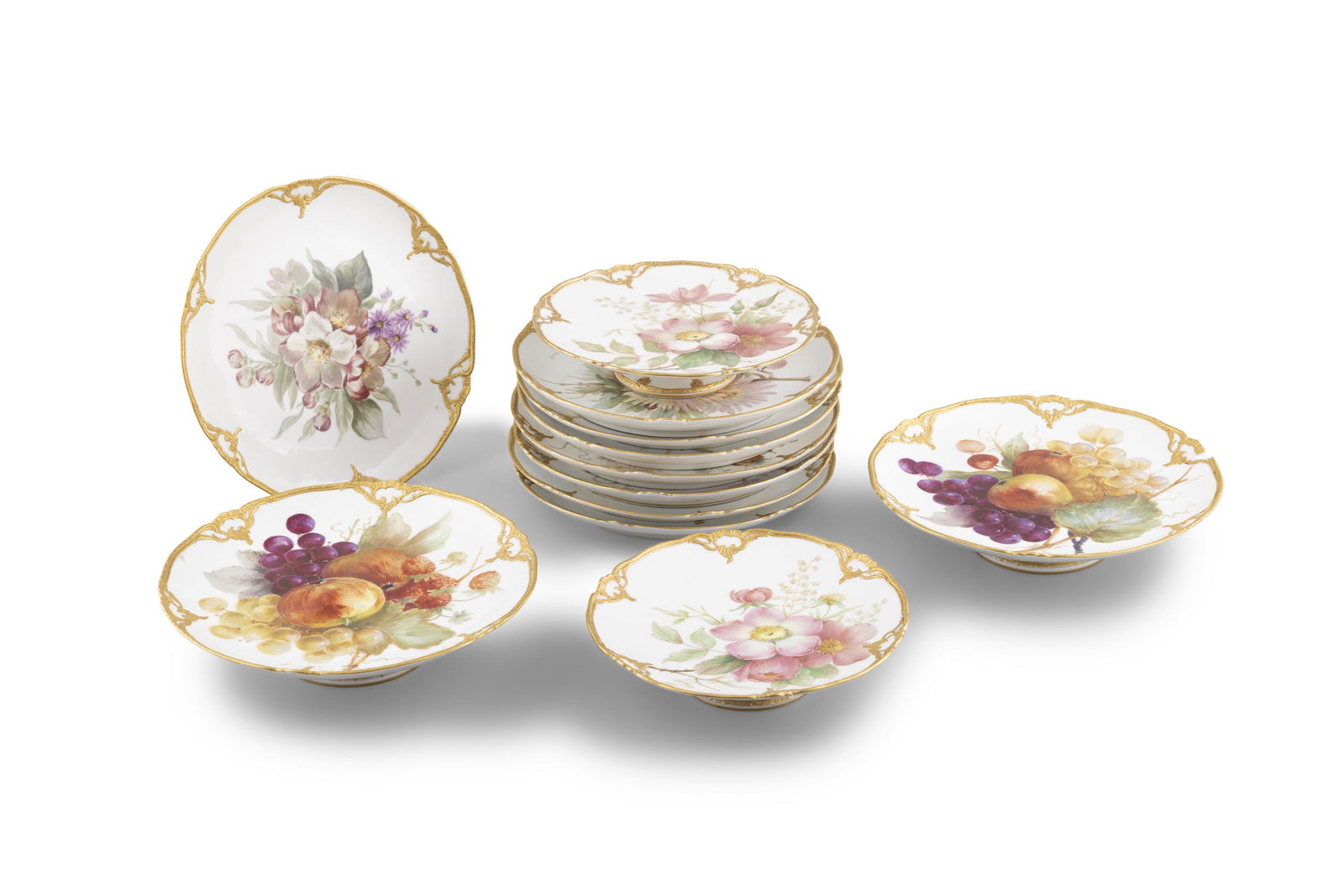 A 'KPM' HAND PAINTED PORCELAIN DESSERT SERVICE  comprising a set of eight plates and two pairs of (1 of 4)