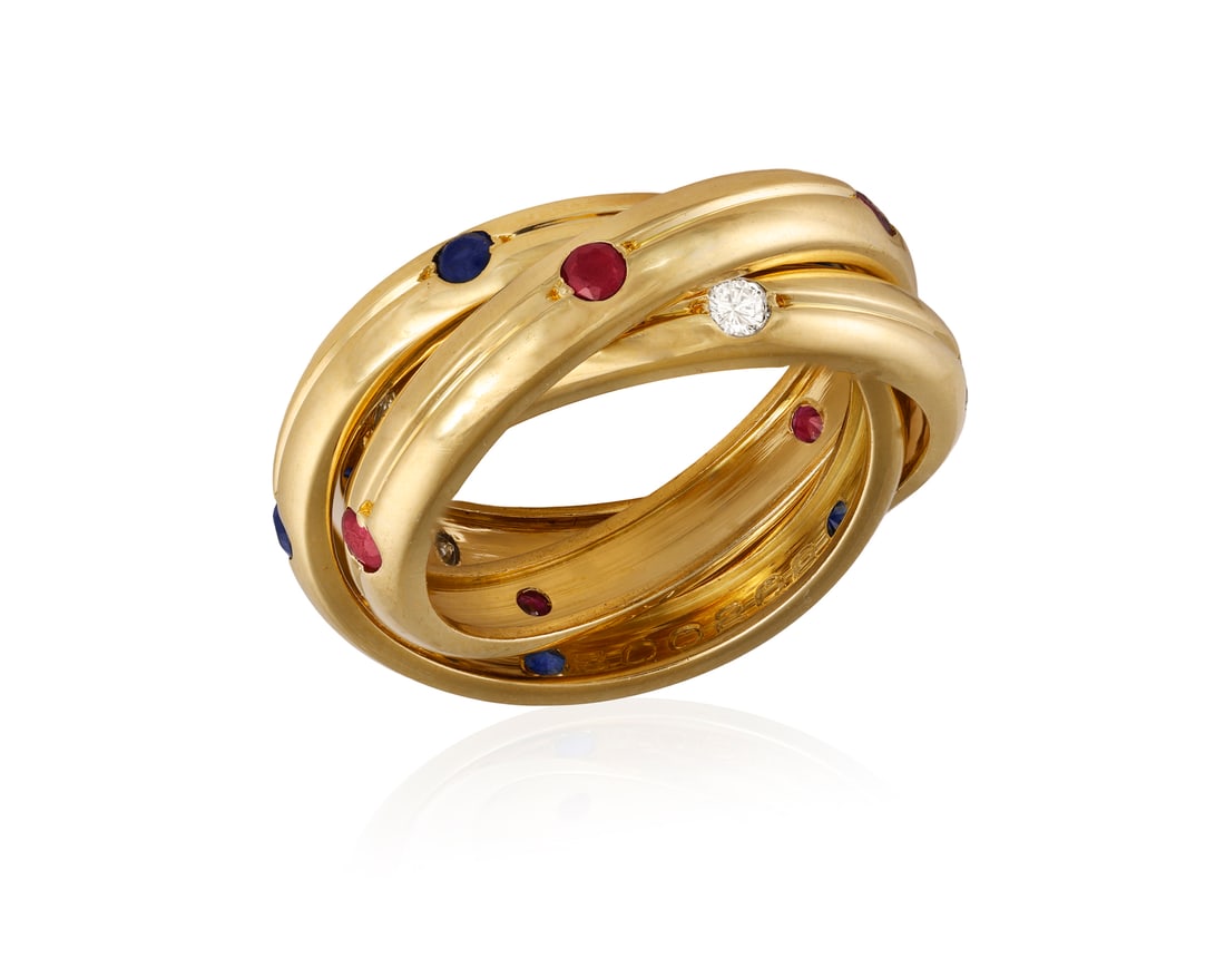 A GEM-SET 'TRINITY' RING, BY CARTIER  The interlocking reeded bands accented at intervals by brillia (1 of 6)