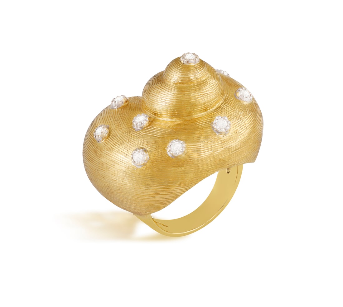 A DIAMOND COCKTAIL RING Modelled as a brushed reeded sea shell accented with brilliant-cut diamonds: A DIAMOND COCKTAIL RING Modelled as a brushed reeded sea shell accented with brilliant-cut diamonds, mounted in 18K gold, ring size M