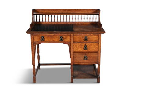 AN ARTS & CRAFTS STAINED OAK DESK ATTRIBUTED TO SHAPLAND & PETTER OF BARNSTABLE, with raised shelf: AN ARTS & CRAFTS STAINED OAK DESK ATTRIBUTED TO SHAPLAND & PETTER OF BARNSTABLE, with raised shelf on a galleried frieze, a gilt tooled leather scriver and raised above one long and three short side d