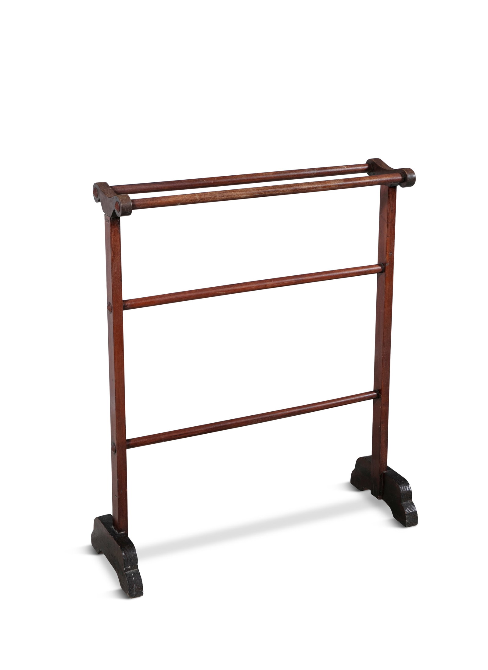 A REGENCY TOWEL RAIL of upright rectangular form, the top with turned twin rails above two tiers of: A REGENCY TOWEL RAIL of upright rectangular form, the top with turned twin rails above two tiers of single rails, raised on trestle supports 82cm high, 76cm wide, 18cm deep