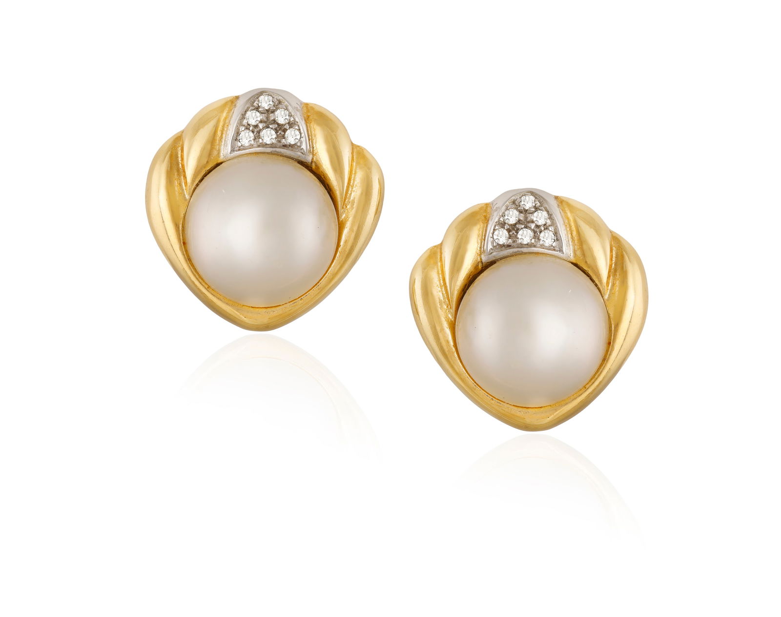 A PAIR OF 18CT GOLD, CULTURED PEARL AND DIAMOND EAR CLIPS BY BUCHERER Cartouche-shaped, the culture: A PAIR OF 18CT GOLD, CULTURED PEARL AND DIAMOND EAR CLIPS BY BUCHERER Cartouche-shaped, the cultured pearl surmounted by six single-cut diamonds, with clips for non-pierced ears, total length of ear c
